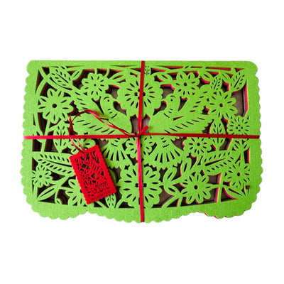 green felt papel picado inspired placemat that features two doves and floral design