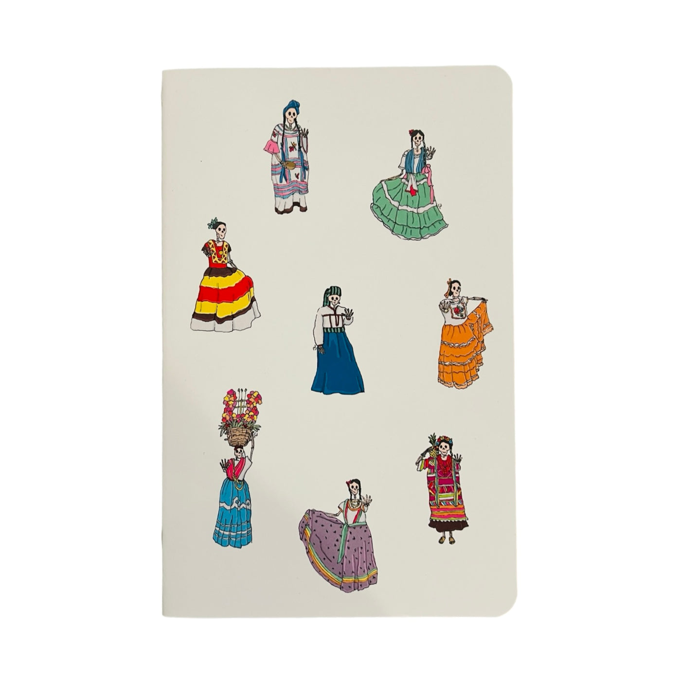 skeleton figures adorned in traditional Oaxacan dresses on the cover of a white notebook