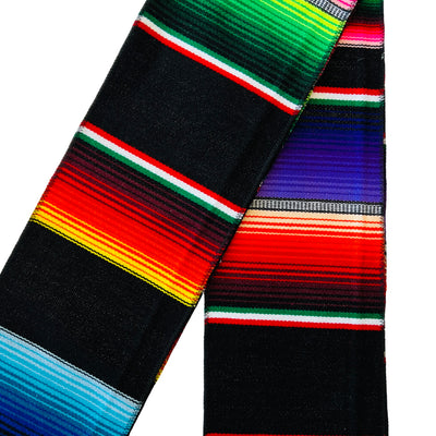 Black serape striped stole folded in half.