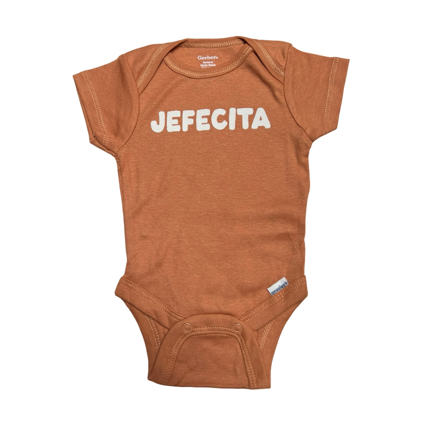 coral onesie with the phrase Jefecita in white lettering