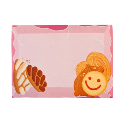 rectangle pink sitcky notes with images of various Mexican pan dulce.