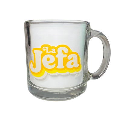 clear glass mug with the phrase La Jefa in yellow and white lettering