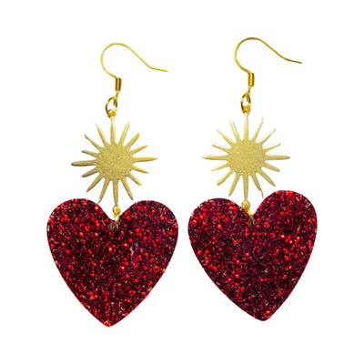 set of red glitter resin heart earrings with a brass sunburst
