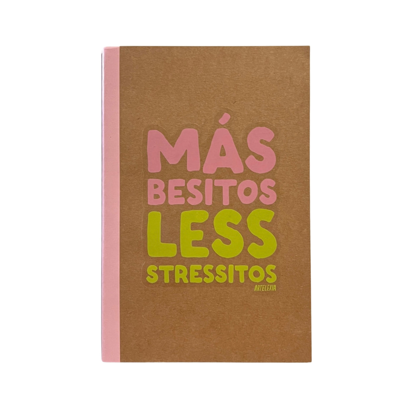 brown notebook with light pink binding and the phrase Mas Besitos Less Stressito in light pink and light green lettering