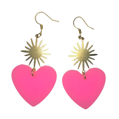 set of light pink resin heart earrings with a brass sunburst