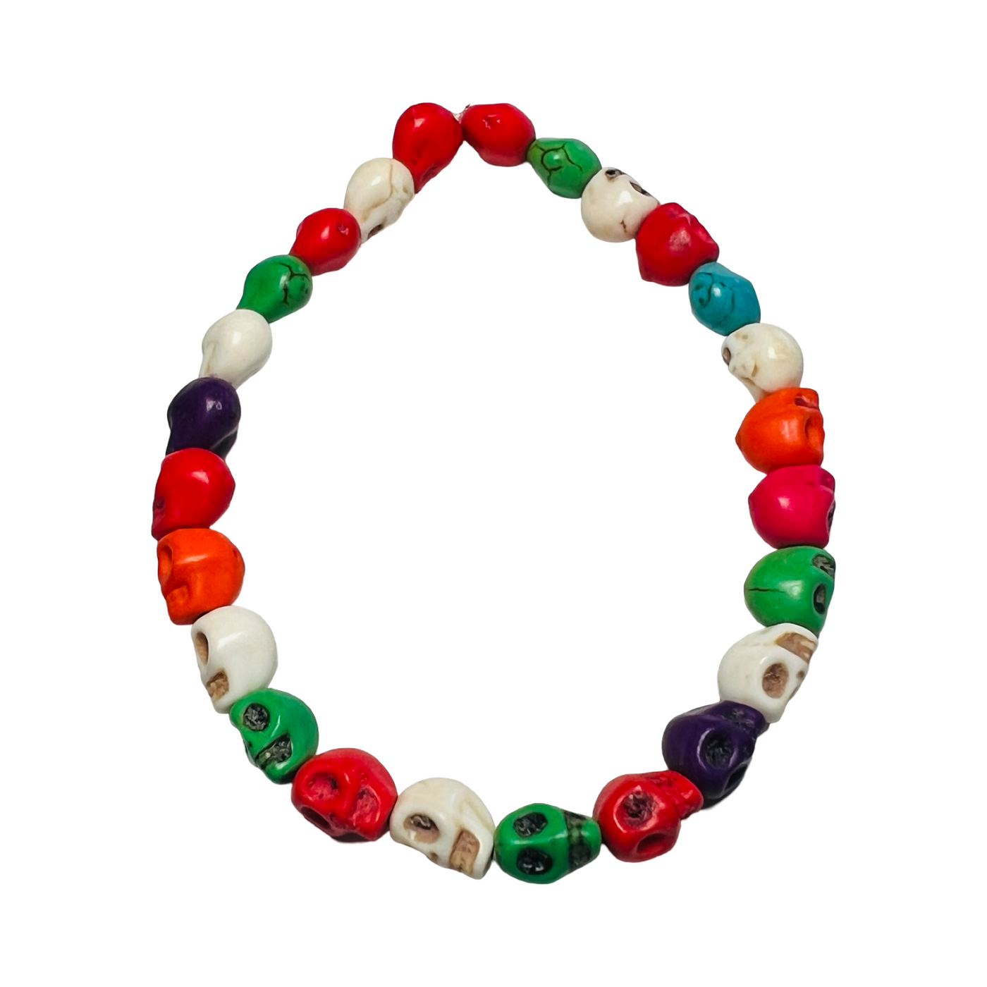 A Mexican Skull Bead Bracelet made of multicolored, hand-carved skull-shaped beads, strung on an elastic band. The bracelet features bright hues of red, green, white, orange, blue, and purple, inspired by Día de Muertos traditions.