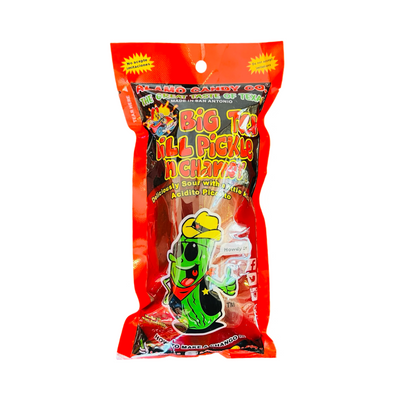 A packaged Big Tex Chamoy Pickle from Alamo Candy Co. in a vibrant red bag featuring a cartoon pickle wearing a cowboy hat and bandana. The packaging highlights the pickle’s sour and spicy flavor with chamoy, with text in both English and Spanish.