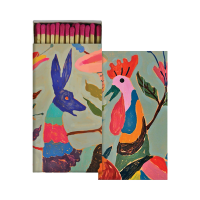 set of box matches with one having an image of a rooster and another with the image of a deer. One box is open with red tip matches.
