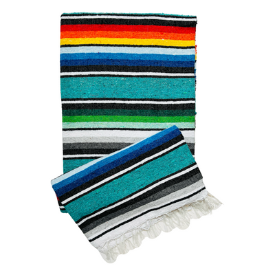 teal serape striped blanket folded in half.