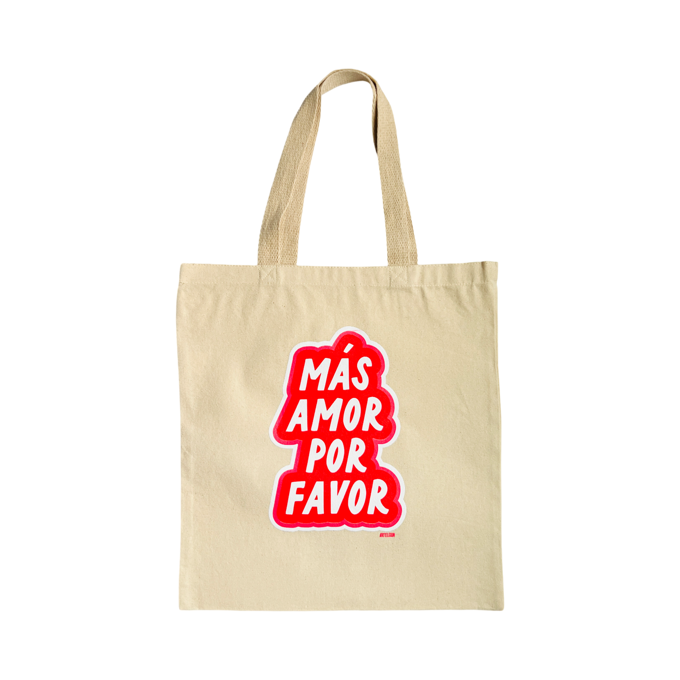 beige tote bag with the phrase Mas Amor Por Favor in white lettering outlined in red