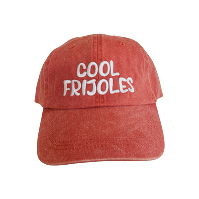 front view of a coral hat with the phrase cool frijoles in white lettering