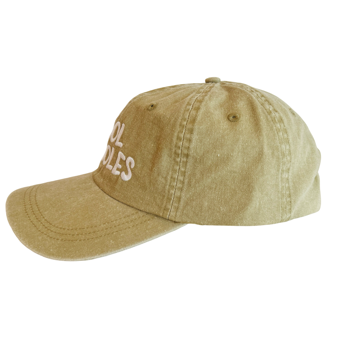 side view of a beige hat with the phrase cool frijoles in white lettering