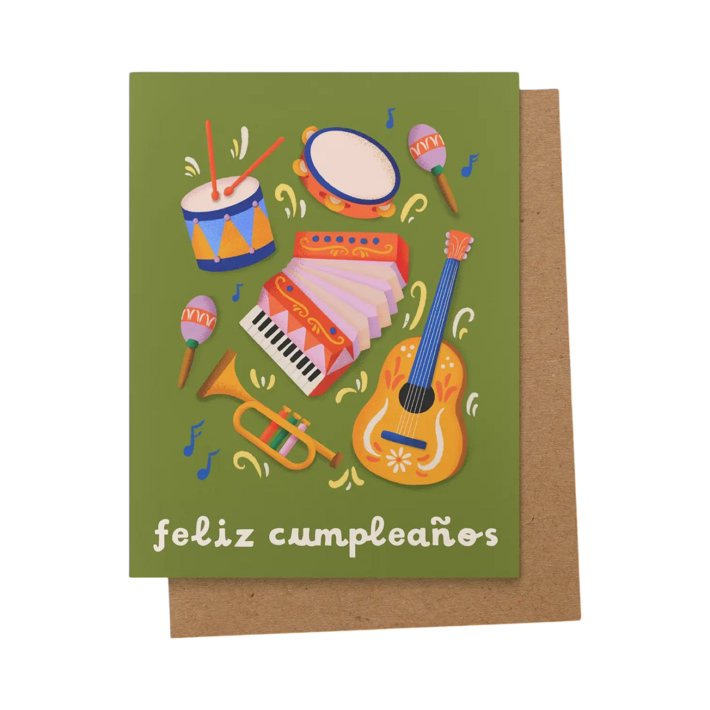 front of greeting card featuring green background & multicolor acoustic musical instruments. Text reads "feliz cumpleaños"