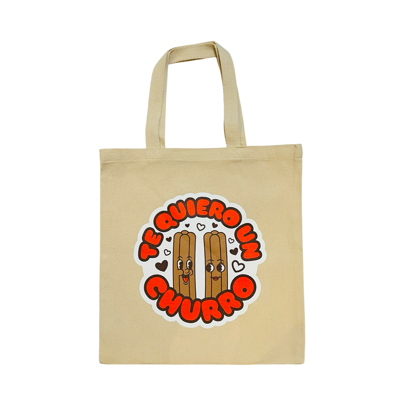 Natural canvas tote bag with an illustration of two churros lovingly staring at each with we hearts surrounding them and featuring the phrase Te Quiero un Churro in dark orange bubble lettering outlined in brown.