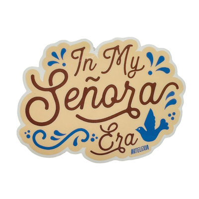 cream colored sticker with the phrase In My Senora Era in brown lettering with blue filagree and bird