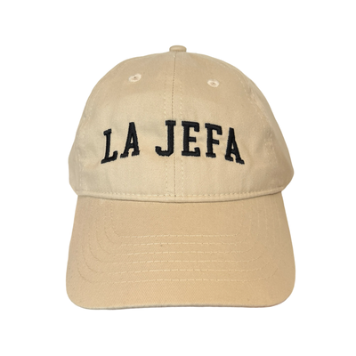 front view of a khaki hat with the phrase La Jefa in black lettering