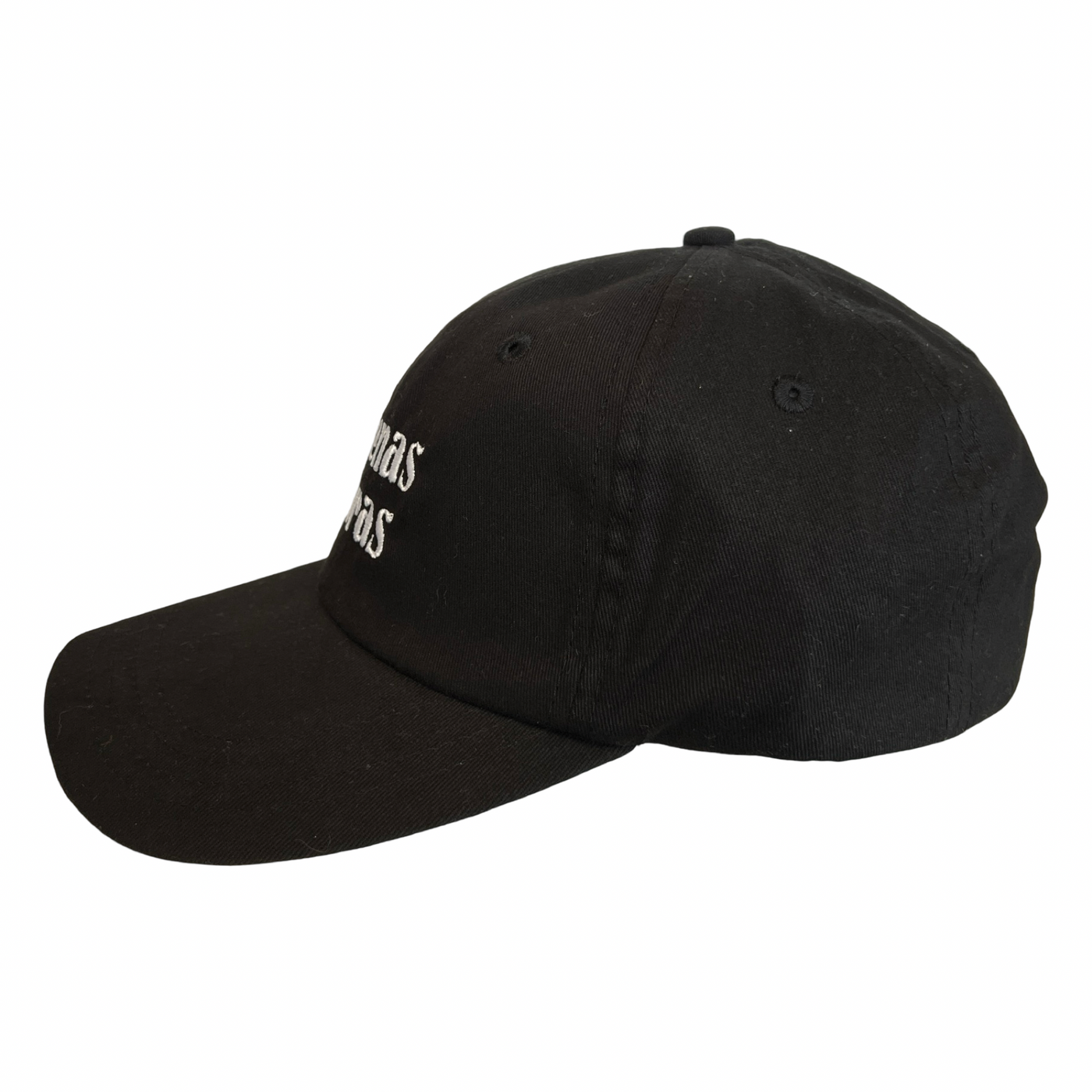 side view of a black hat with the phrase Buenas Vibras in white lettering