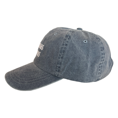 side view of a heathered blue hat with the phrase Buenas Vibras in white lettering