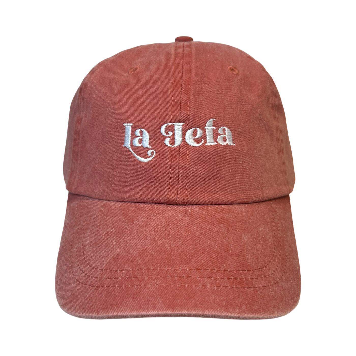 Front view of a coral hat with the phrase La Jefa in white lettering