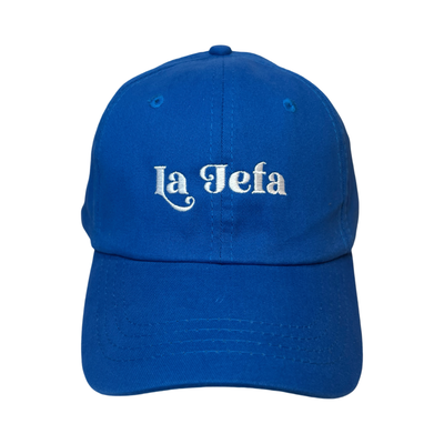 Front view of a royal blue hat with the phrase La Jefa in white lettering