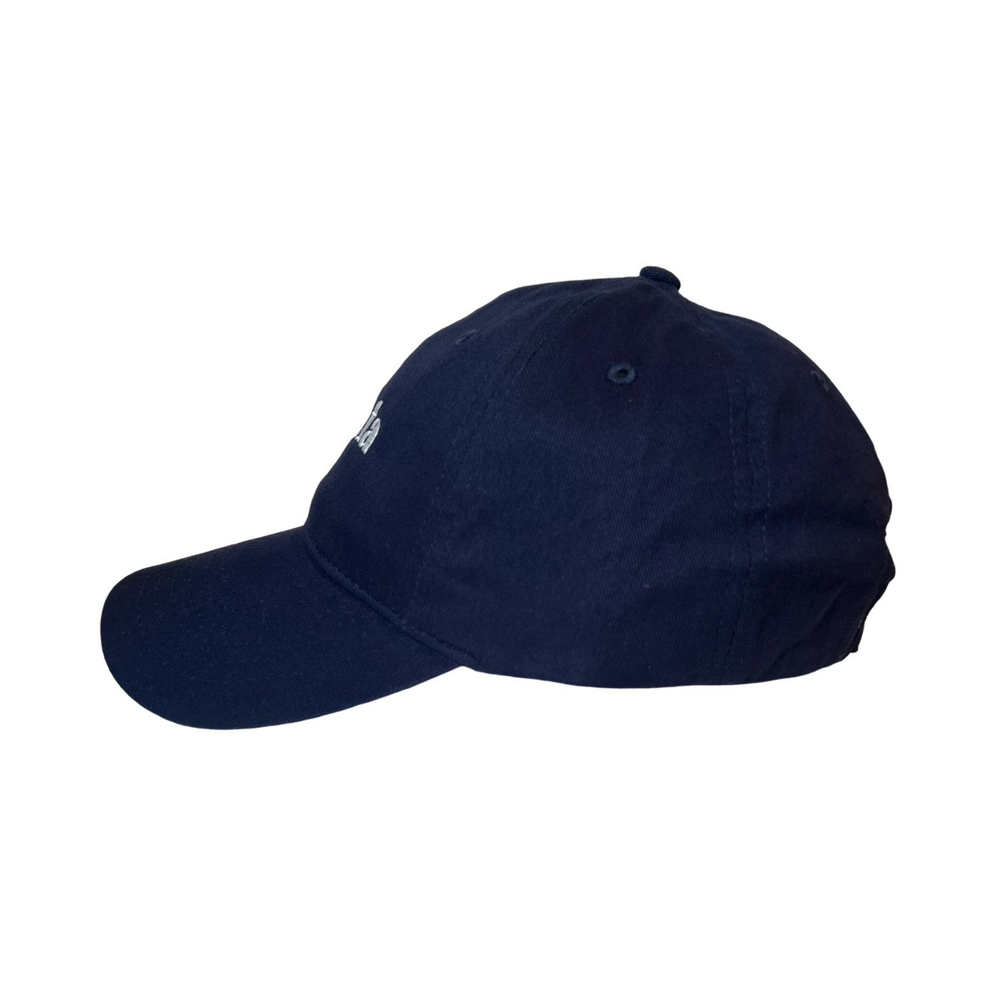 Side view of a navy blue hat with the phrase La Jefa in white lettering