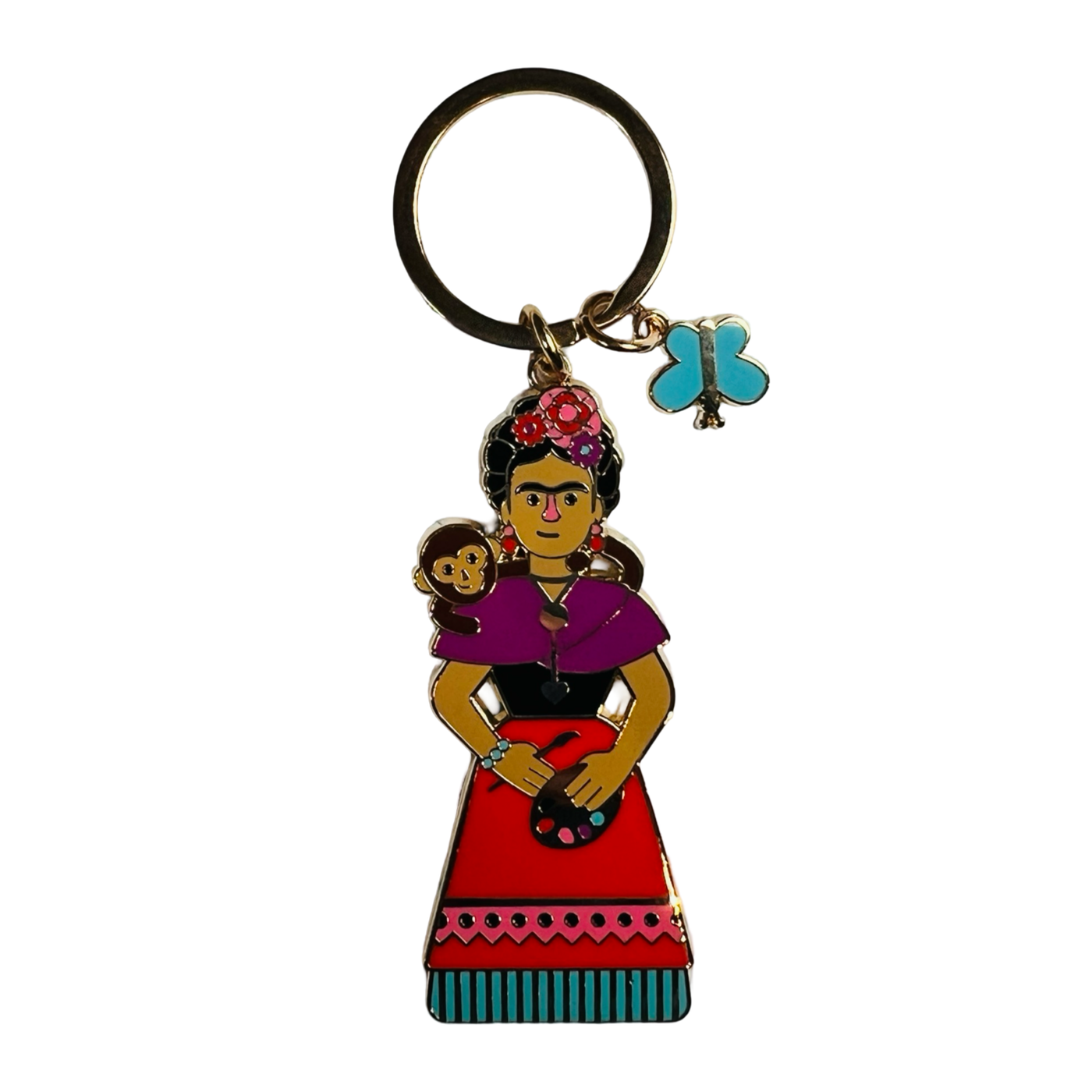 enamel keychain of Frida Kahlo with a moneky on her shoulder while holding a paint palette and brush.