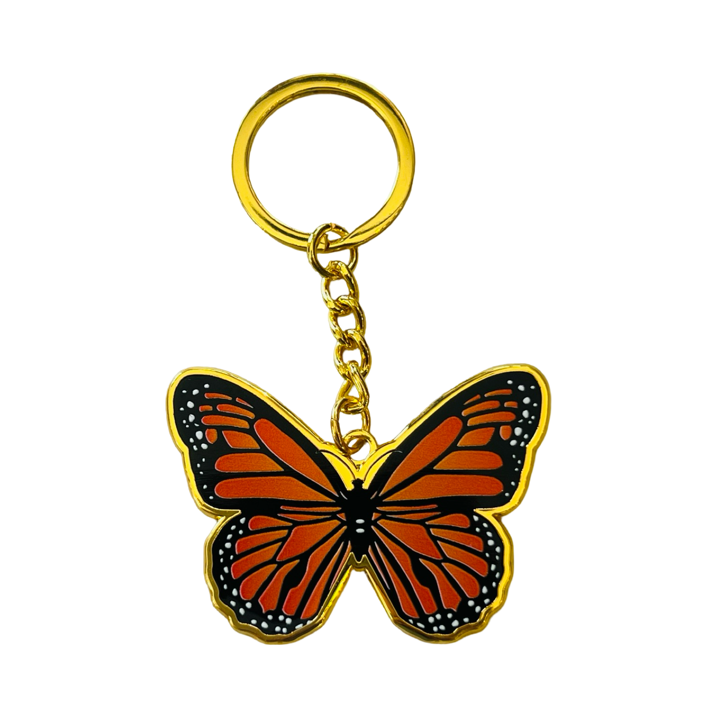 Gold enamel keychain with a monarch colored design