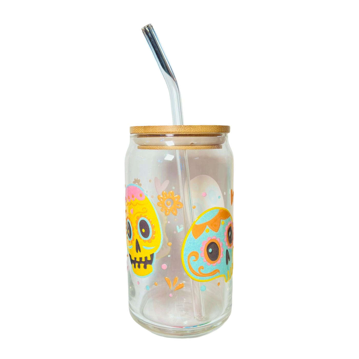 clear glass can tumbler with a glass straw featuring two colorful sugar skulls, hearts and flowers.