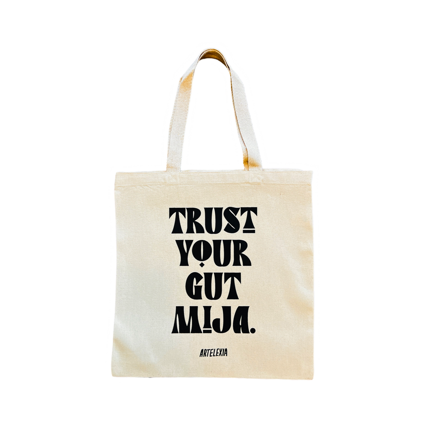 Natural canvas tote bag with the phrase Trust Your Gut Mija in black lettering 