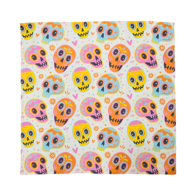 square cream kitchen towel with a pastel colored sugar skulls design