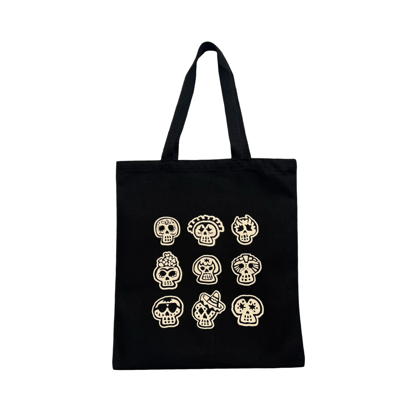 black tote bag with 9 images of various sugar skull designs in cream coloring.