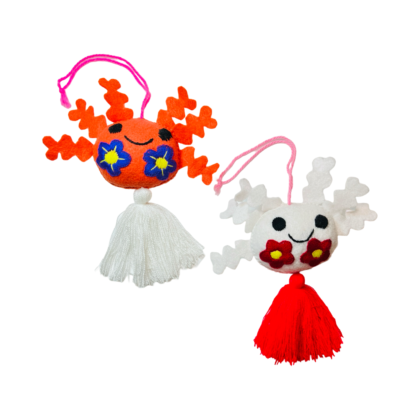 set of multi-colored felt axolotl ornaments with tassels.