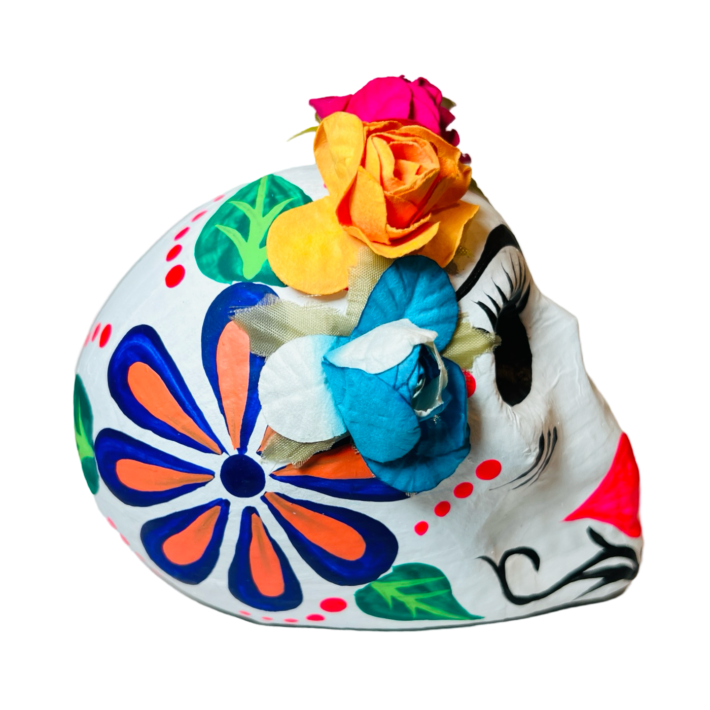 side view of a colorful paper mache frida sugar skull in multiple colors featuring a flower crown.