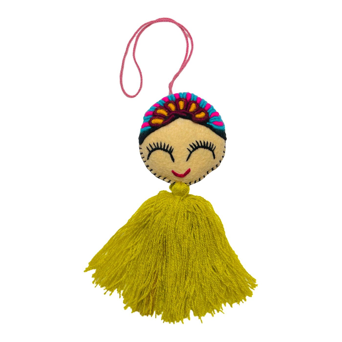 round felt Frida inspired tassel with a flower crown and a yellow tassel.