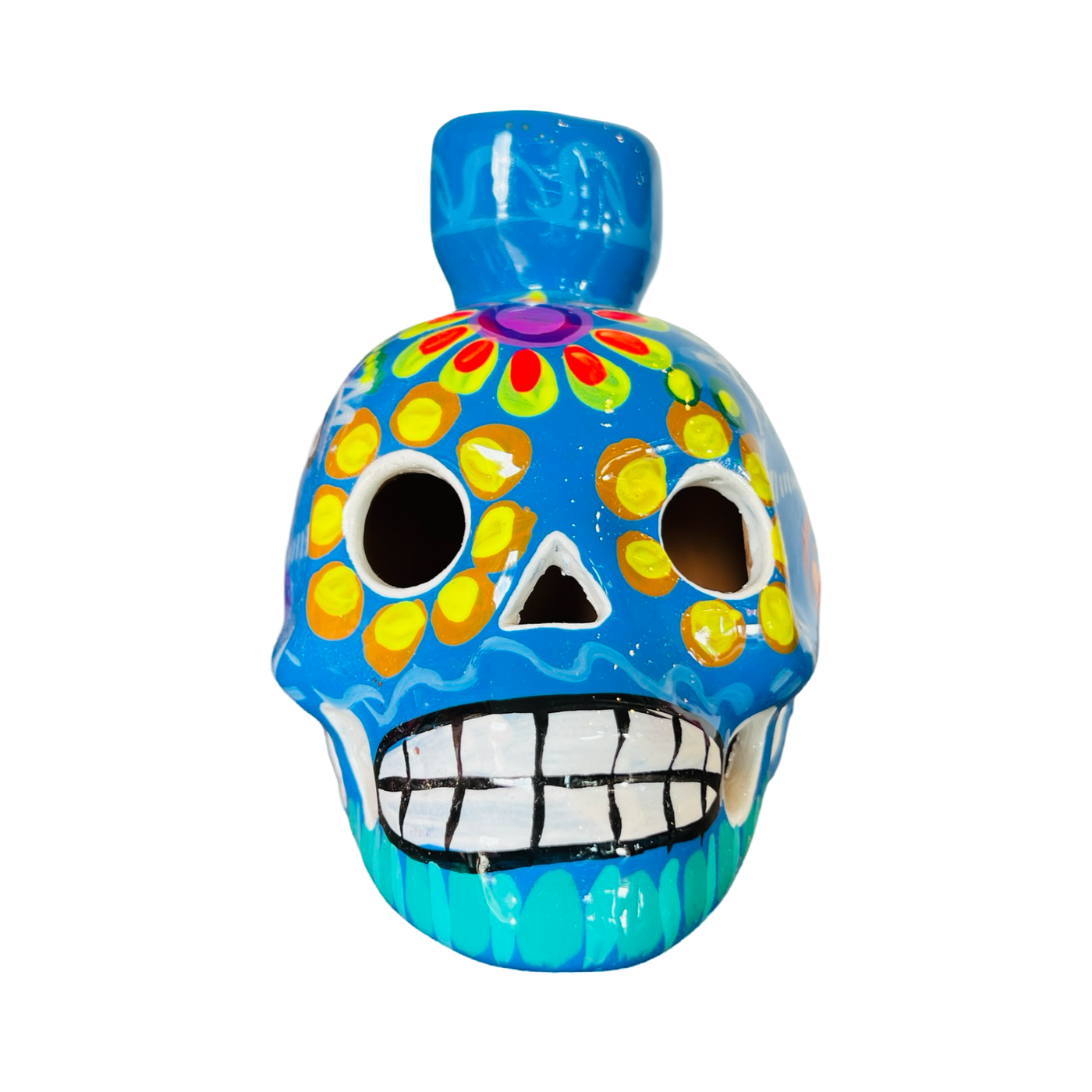 front view of a blue ceramic sugar skull candle holder with a multi-color floral design.