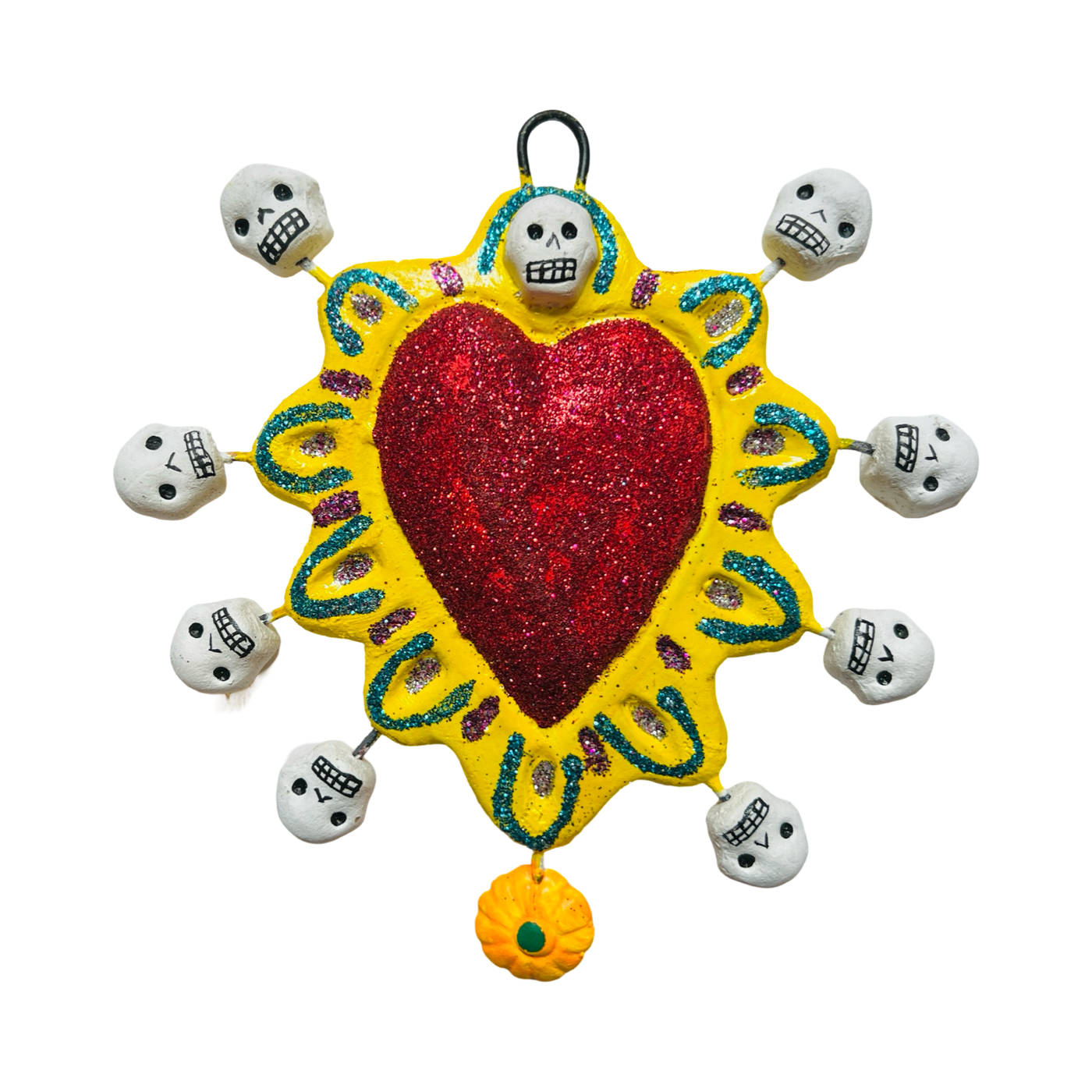 red glitter heart with a yellow border featuring skulls and an orange flower.