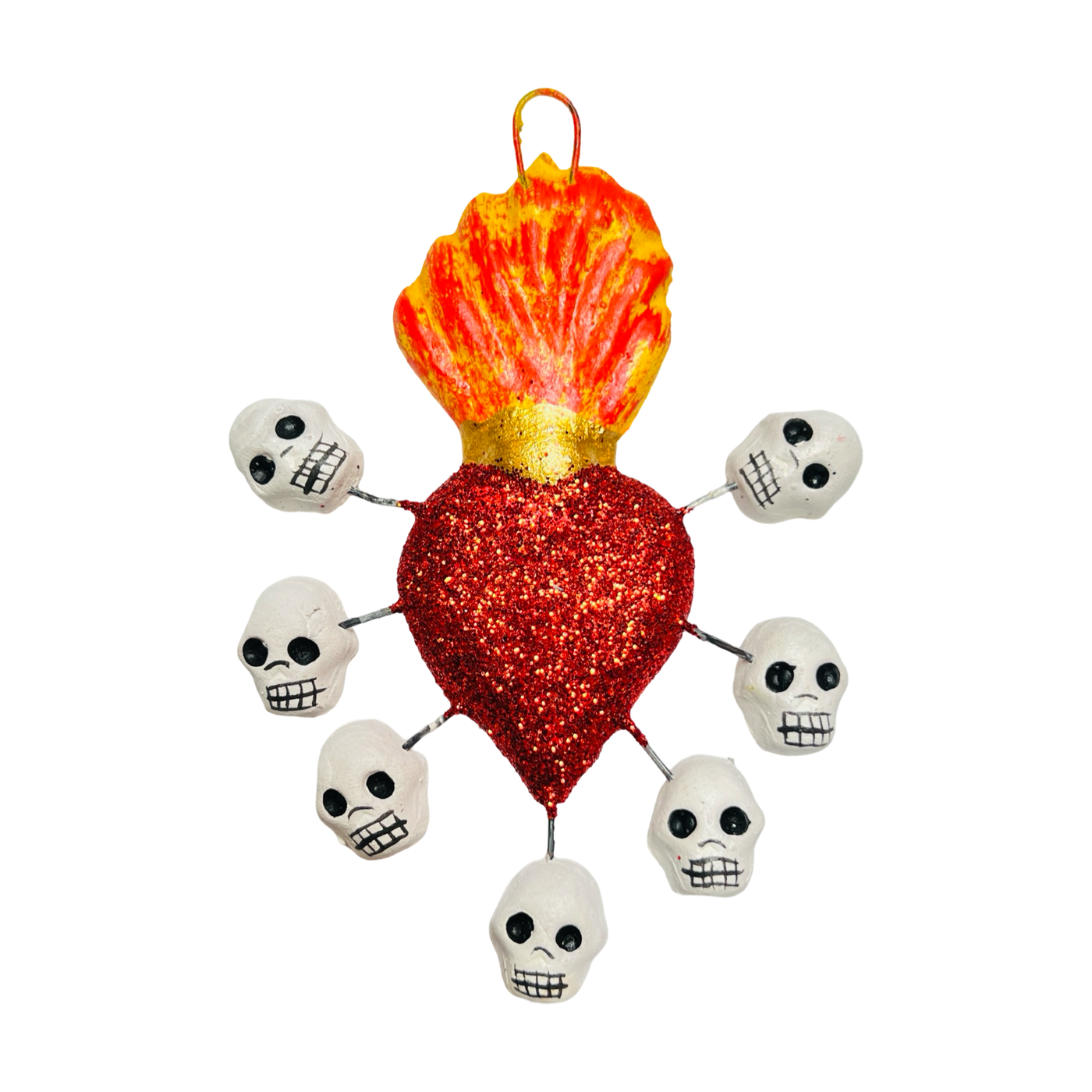 red glitter sacred heart with skull surrounding it.