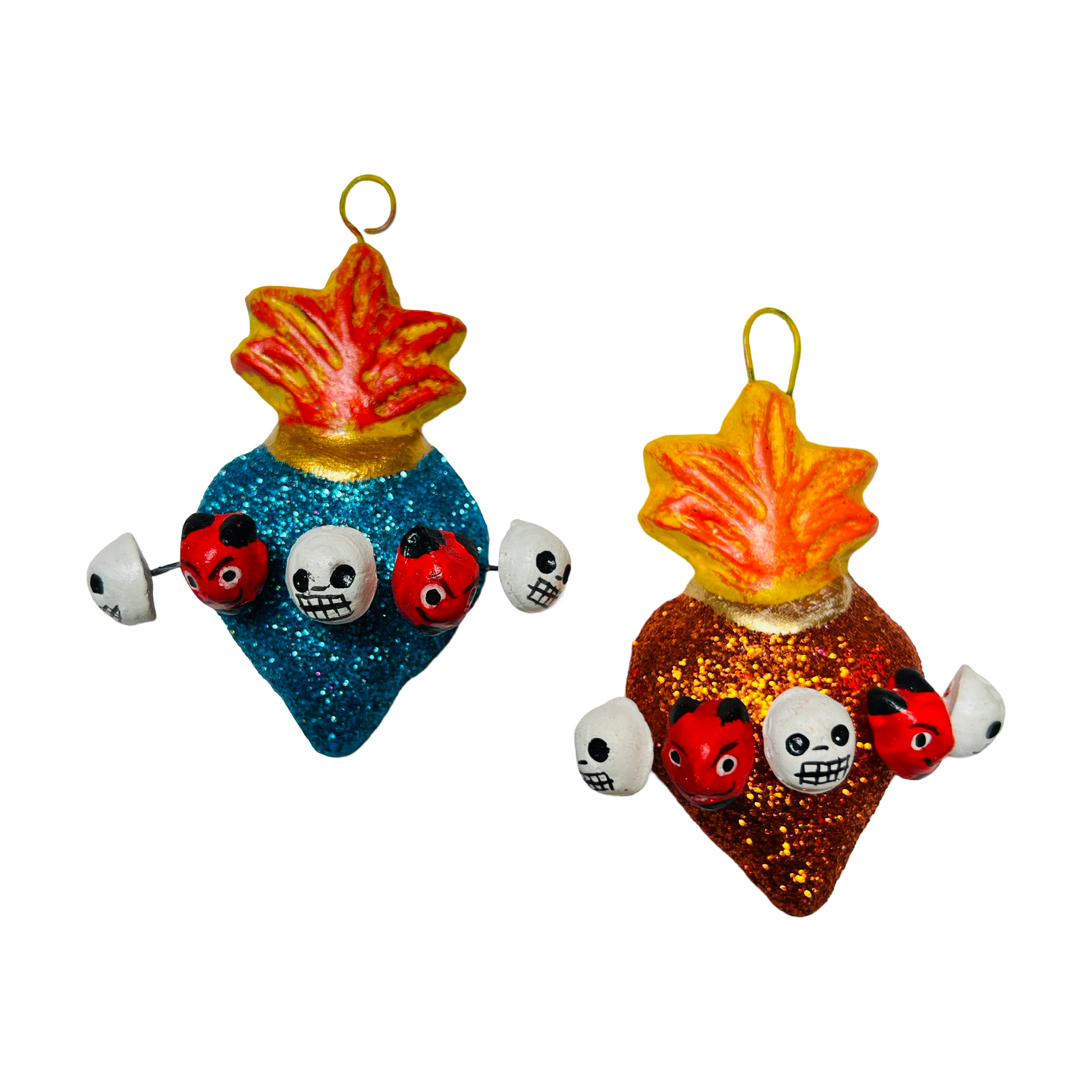 set of multi-colored glitter sacred heart with skulls and devils heads surrounding it.