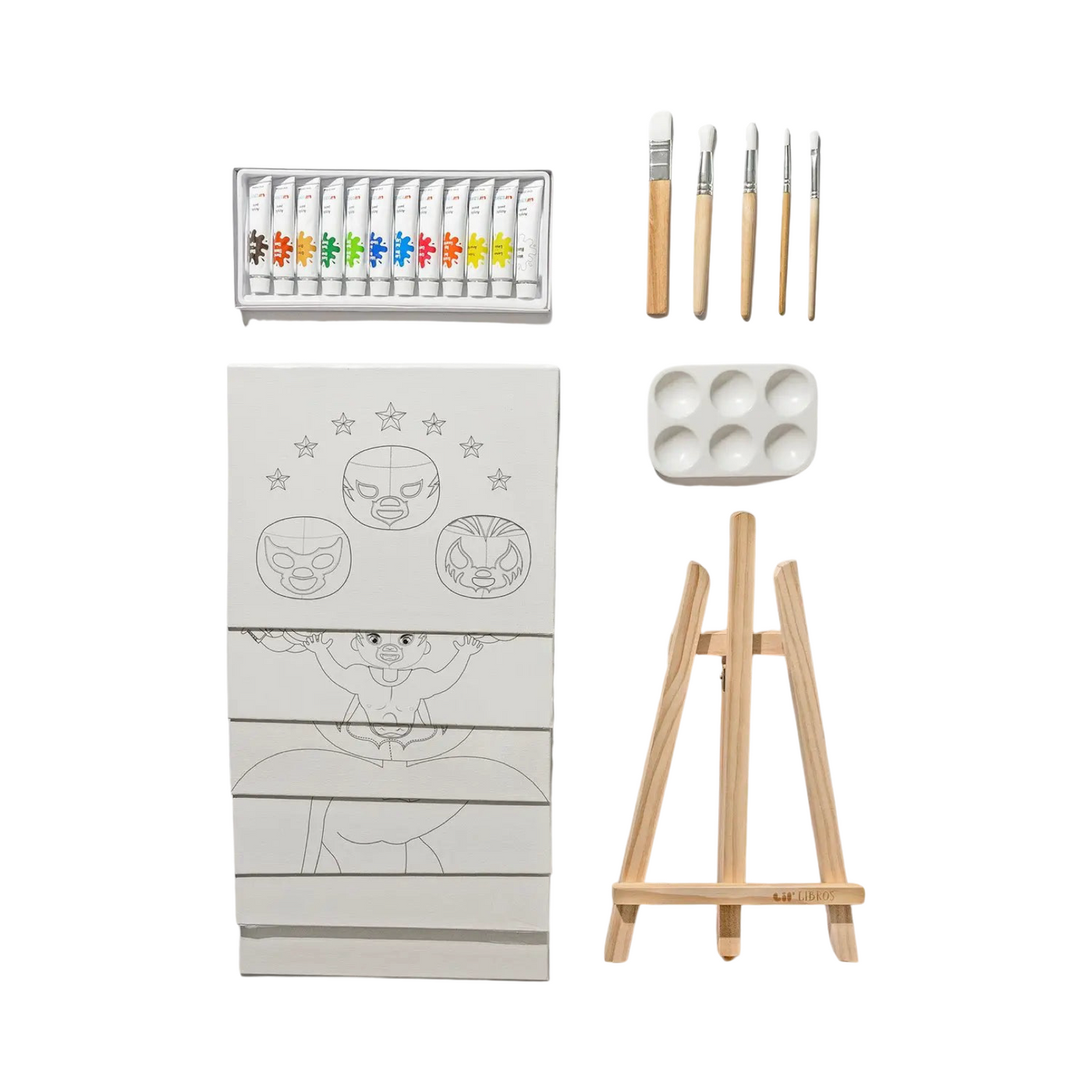 Contents of the Lil' Lucha Libre Art Kit displayed, including a set of acrylic paint tubes, five paintbrushes, a paint palette, a wooden easel, and several pre-drawn canvases with lucha libre-themed designs featuring masked wrestlers and stars