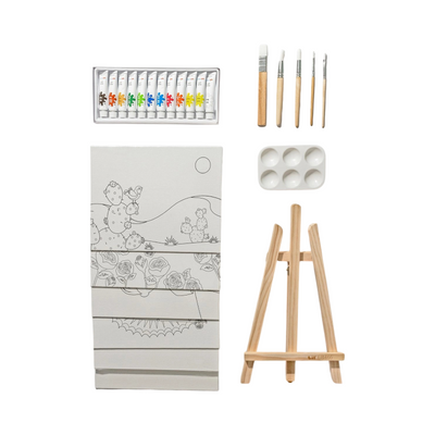 Children's art kit with contents displayed, including acrylic paint tubes, five paintbrushes, a paint palette, a wooden easel, and several pre-drawn canvases featuring designs like cactus, roses, and decorative patterns