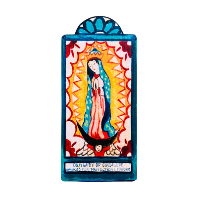 wooden wall hanging that features a painting of the Virgen Mary