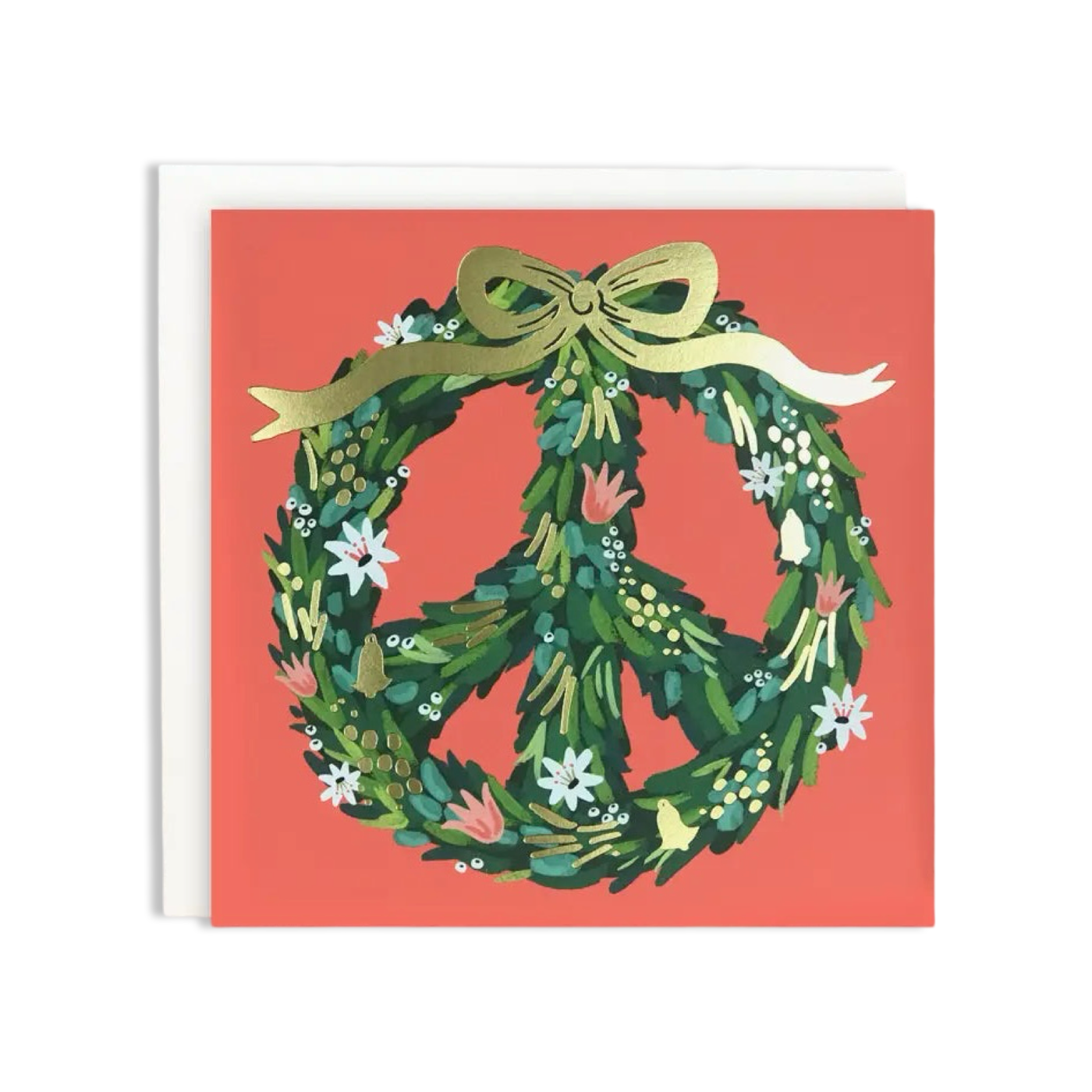 A festive holiday greeting card featuring a peace sign-shaped wreath made of lush greenery and adorned with small flowers, golden bells, and a gold bow. The background is a warm coral color.