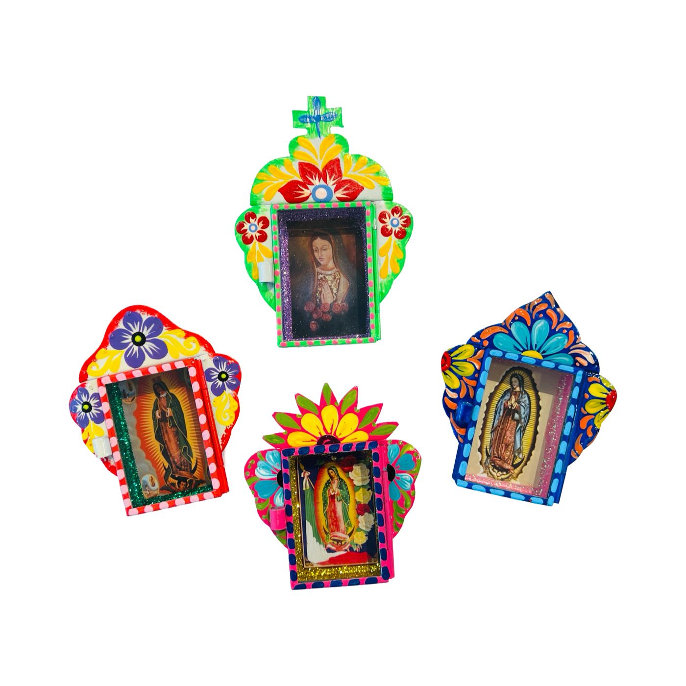 A collection of four colorful tin nichos (shadow boxes) featuring intricate hand-painted designs. Each nicho contains an image of a saint or religious figure, framed by vibrant floral and geometric patterns in bright hues of red, blue, yellow, and green.