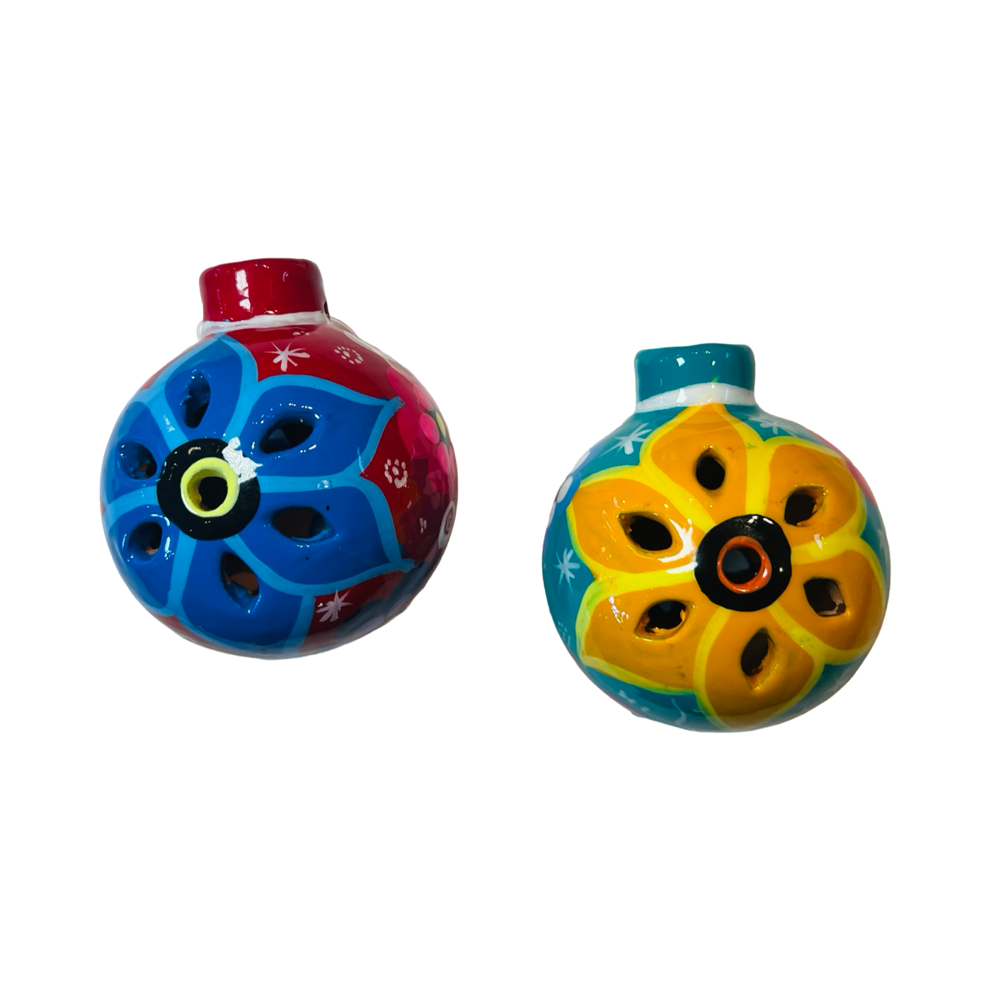 Two ceramic hand-painted round ornaments with intricate floral designs. The left ornament features a blue flower on a red base, and the right ornament showcases a yellow flower on a turquoise base, both reflecting traditional craftsmanship and bright colors.