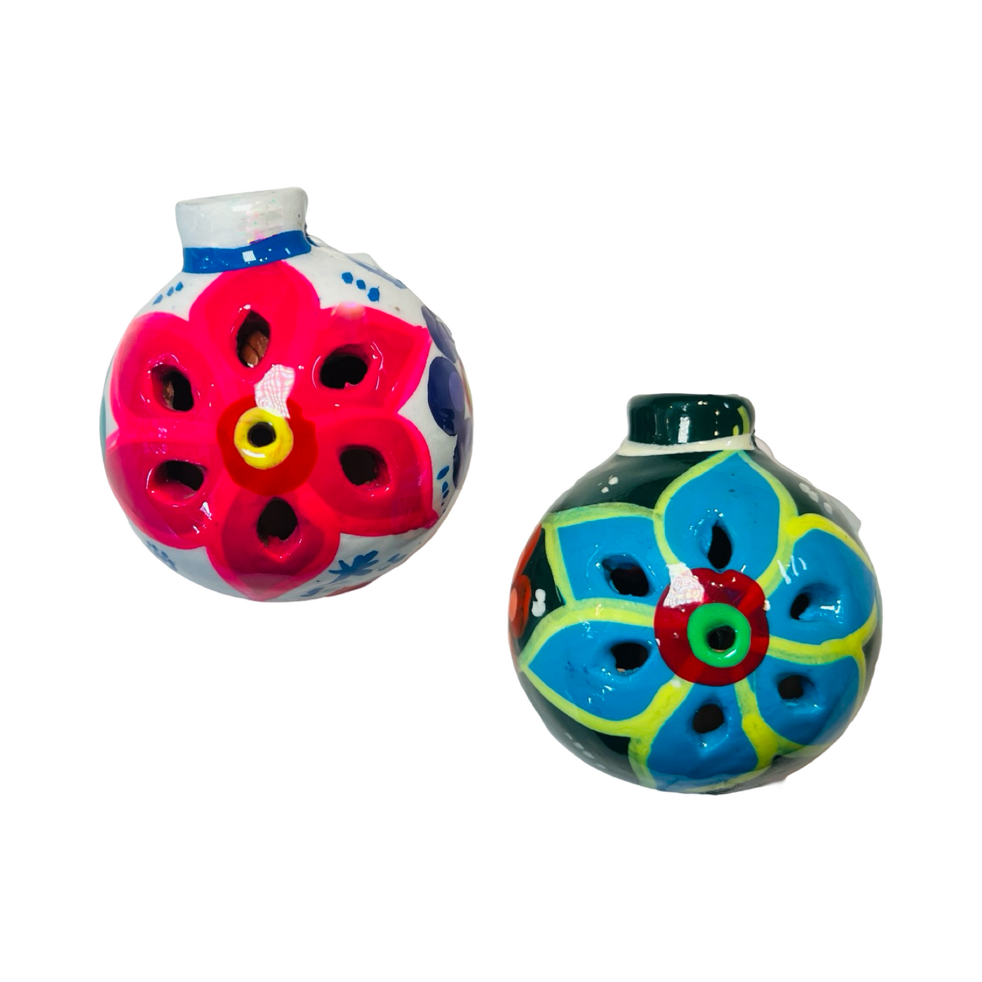 Two ceramic hand-painted round ornaments, one featuring a bright pink floral design on a white base and the other with a vibrant blue floral pattern on a green base, both showcasing intricate details and traditional artistry.