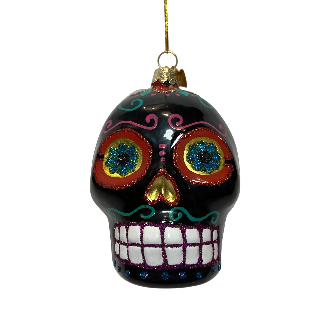 A vibrant black glass ornament in the shape of a Día de los Muertos sugar skull, featuring intricate glitter designs, colorful floral eye accents, and a cheerful, toothy grin.