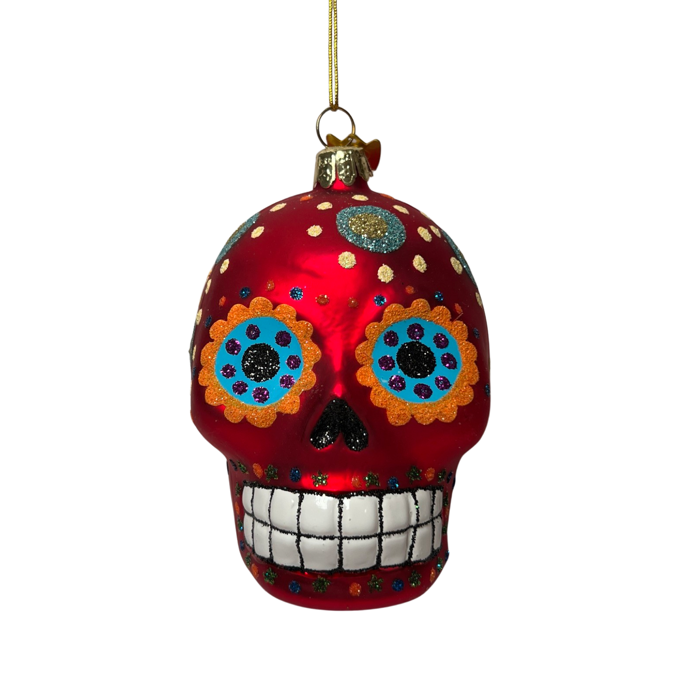 A vibrant red glass ornament in the shape of a Día de los Muertos sugar skull, featuring intricate glitter designs, colorful floral eye accents, and a cheerful, toothy grin.