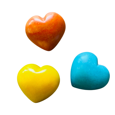 three stone hearts; orange, yellow, teal