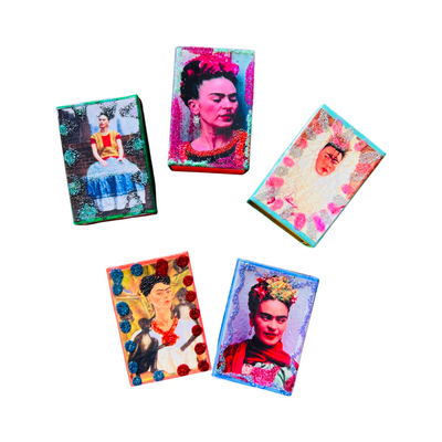 5 boxes of matches with various images of Frida Kahlo and decorated with colored glitter