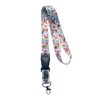 white lanyard with an otomi-inspired design